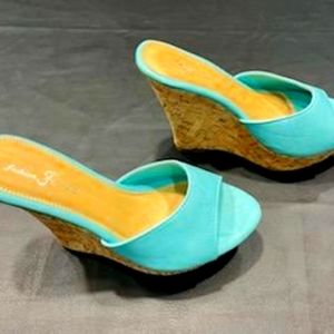 Women's aqua wedge heel size 10.